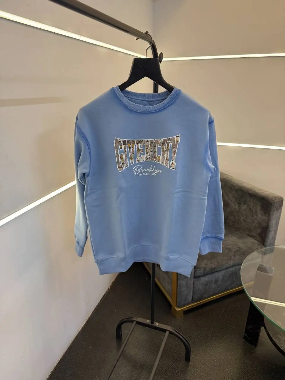Givenchy imported fleece sweatshirt with spray print and front branding sky blue