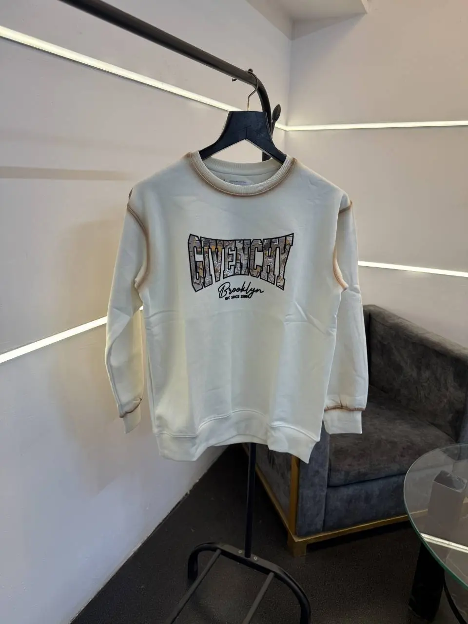 Givenchy imported fleece sweatshirt with spray print and front branding cream