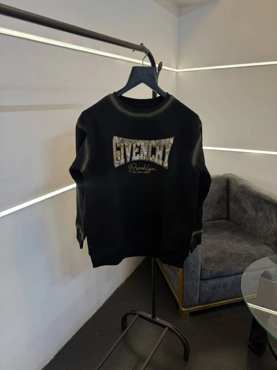 Givenchy imported fleece sweatshirt with spray print and front branding black