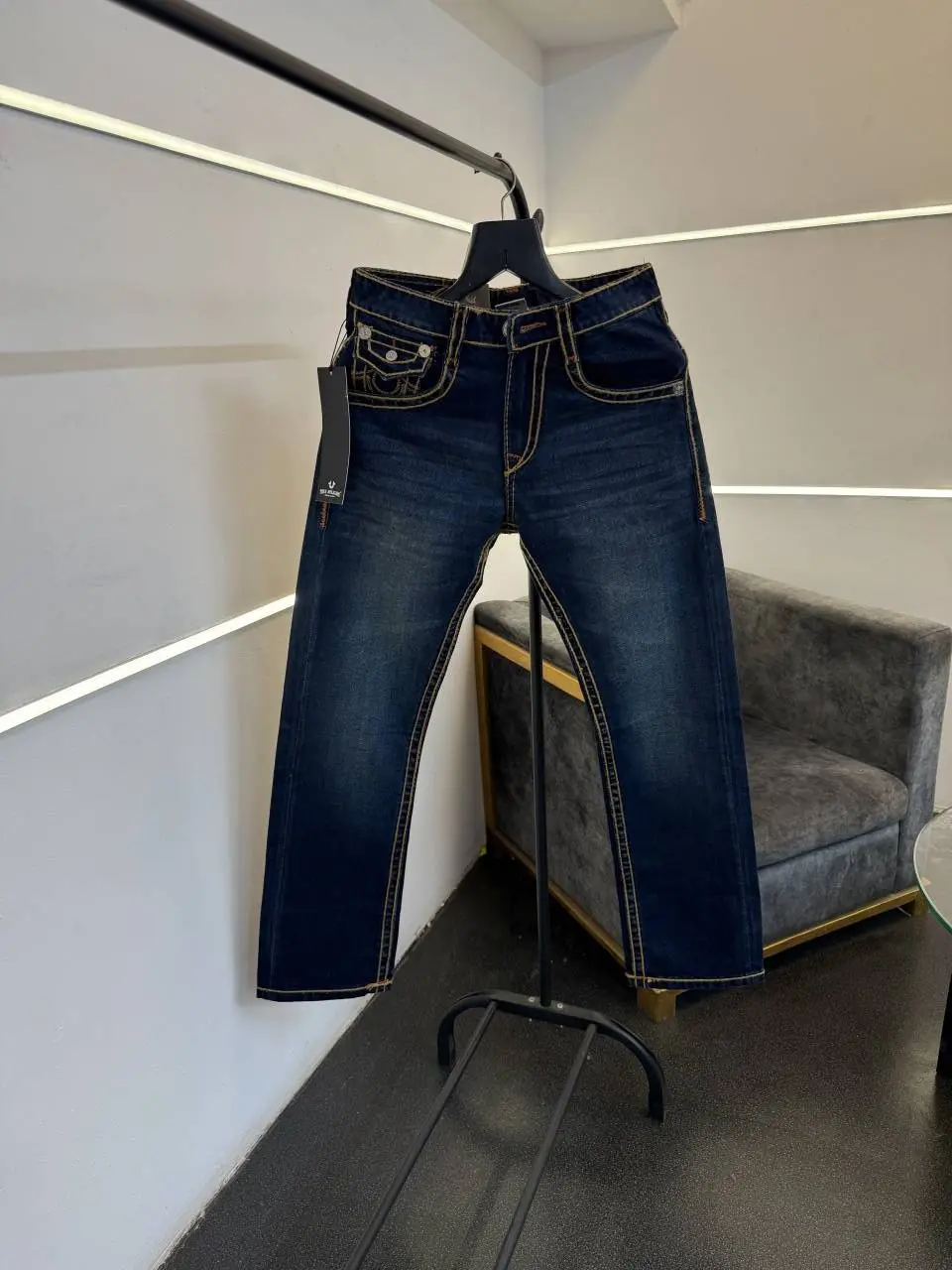 True religion hyperflex blue imported denim with brand button and pattern on back
