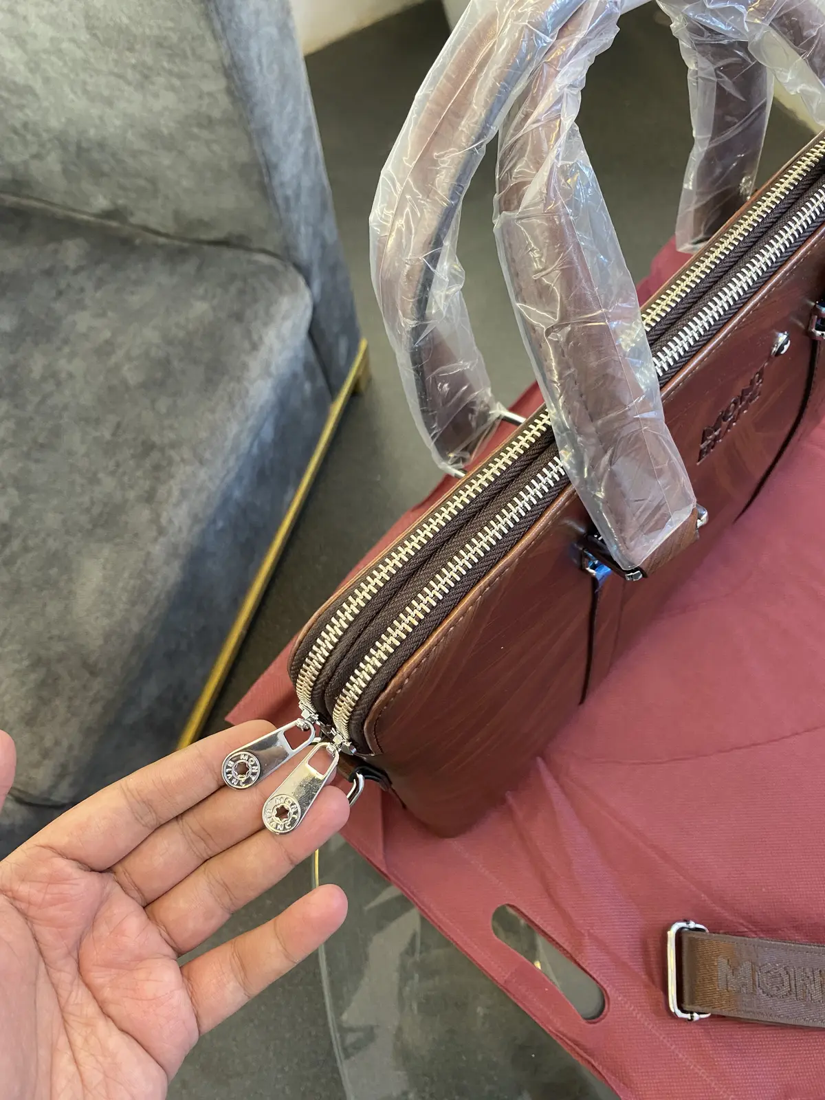 Montblan c Wooden leather finish imported laptop bag with double zip and back zip and brand strap brown - Image 3