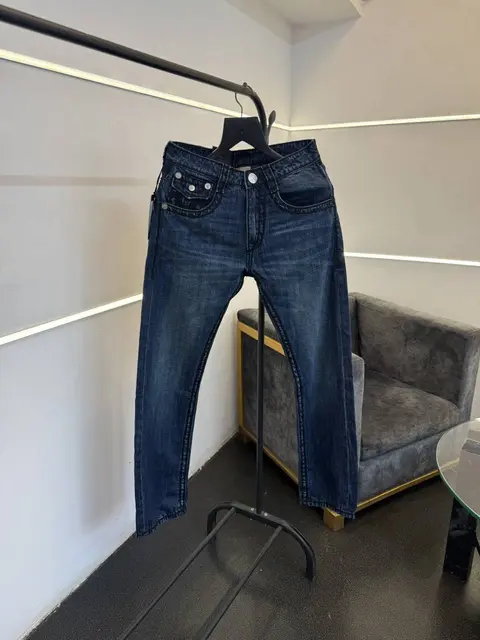 True religion hyperflex blue imported denim with brand button and pattern on back