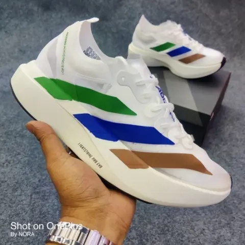 Adiddasadizero adios pro evo 1 pharrell earth sneakers