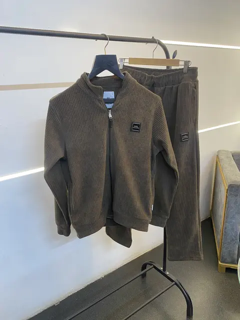 Coach imported tracksuit with brand zip and knitted fabric along with side pockets brown