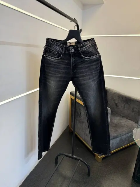 Burberry Hyperflex imported carbon black denim with brand button and packing